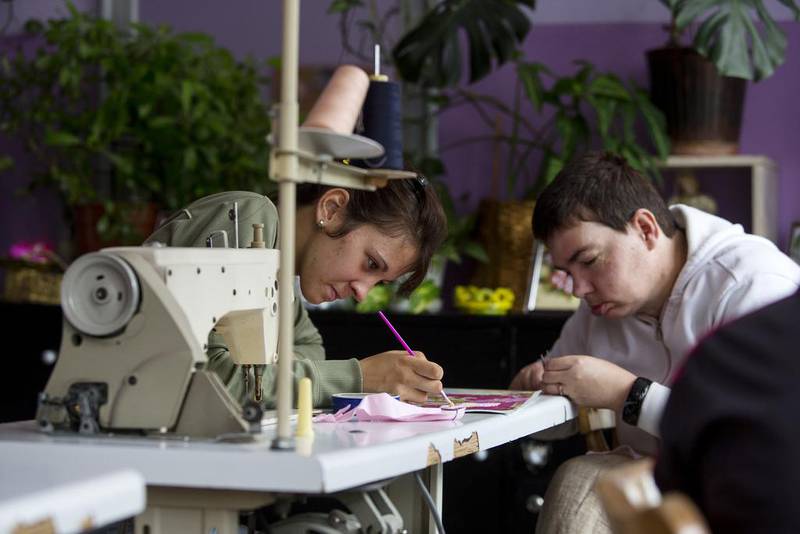 Residents of the Home for Children and Youth take part in a tailoring workshop in Sremicа.
