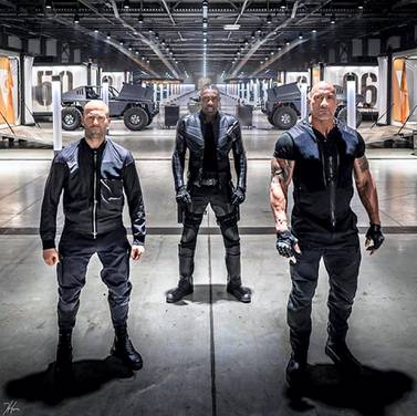 Jason Statham, Idris Elba, and Dwayne Johnson in 'Fast & Furious Presents: Hobbs & Shaw', which is due to be released in August 2019. Courtesy Universal Pictures