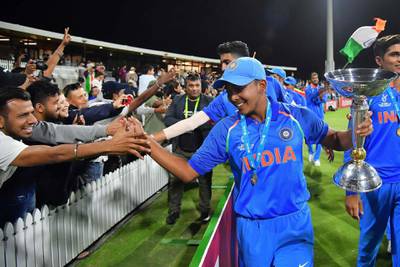 India's captain Prithvi Shaw (C) celebrates the team's victory with fans after the U19 cricket World Cup final match between India and Australia at Bay Oval in Mount Maunganui on February 3, 2018. / AFP PHOTO / Marty MELVILLE