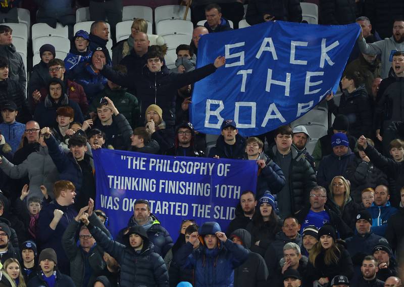 Everton fans with banners protesting against the club's owners. Reuters