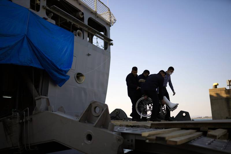 An injured survivor at a makeshift hospital set up at Turkish Bayraktar warship anchored near Iskenderun city, southern Turkey. AP