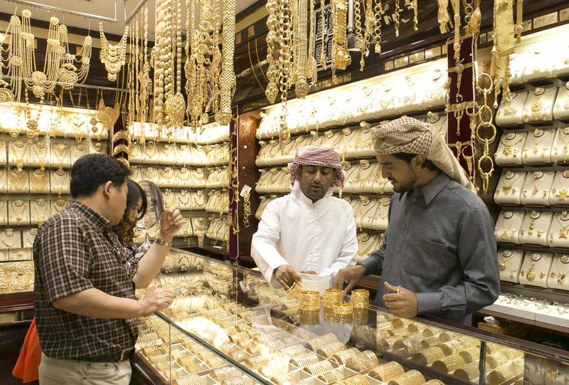 Shoppers in a jewellery shop at the Gold Souq in Deira