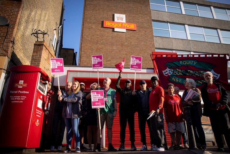 Royal Mail staff join a Communication Workers Union strike outside a post office in London. According to CWU, more than 115,000 postal workers are on strike in a dispute over pay, the biggest walkout since 2009. EPA