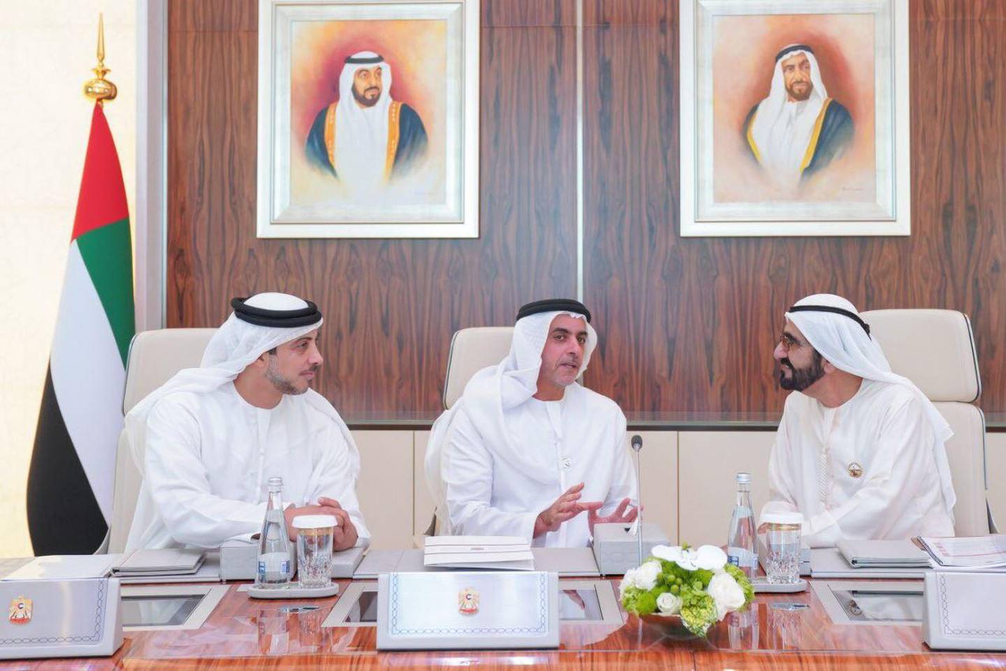 Deputy Prime Ministers Sheikh Mansour bin Zayed and Sheikh Saif bin Zayed speak with Sheikh Mohammed at the Cabinet meeting. Courtesy: Dubai Media Office