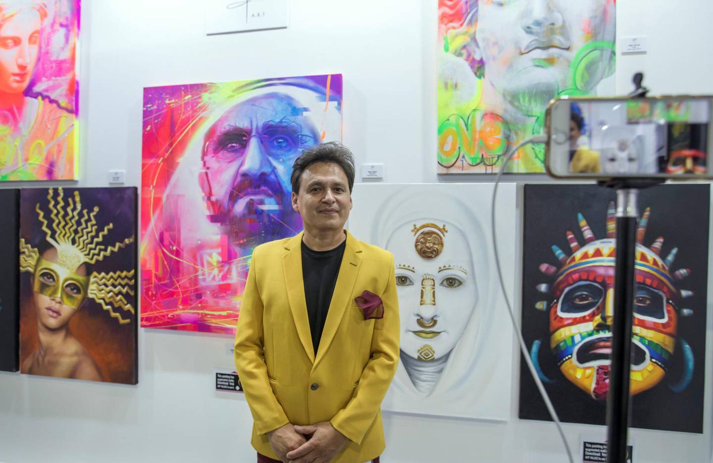 Dubai, United Arab Emirates - Artist Coco Valdez with his augmented artworks at the World Art Dubai at Dubai World Trade Centre.  Leslie Pableo for The National for Razmig's story