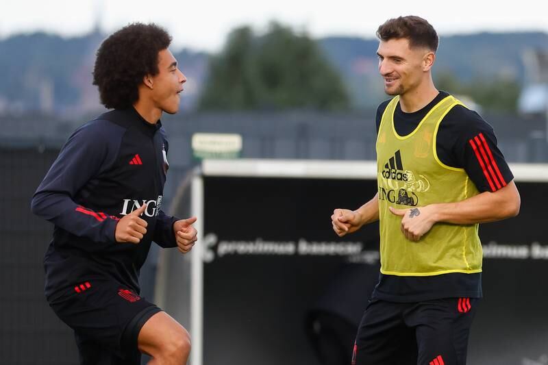 Belgian players Axel Witsel, left, and Thomas Meunier attend their team's training session in Tubize, Belgium. EPA