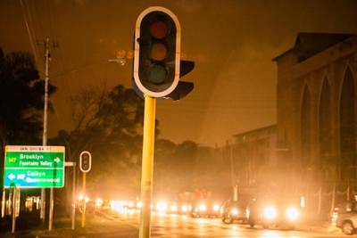 Slow-moving vehicles line the streets as traffic lights stand without power during a load-shedding power outage period in Pretoria, South Africa, on Wednesday, Feb. 13, 2019. Eskom Holdings SOC Ltd. cut supplies for the fifth day on Thursday and warned its power generation system remains "vulnerable." Photographer: Waldo Swiegers/Bloomberg