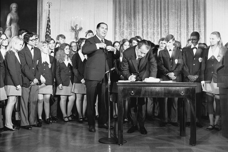 In this July 4, 1971 photo, President Richard Nixon signs the Constitution's newest amendment which guarantees 18-year-olds the right to vote in all elections. AP Photo
