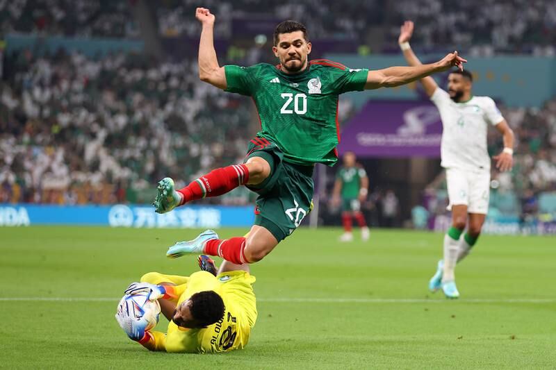 Mohammed Al Owais of Saudi Arabia saves from Mexico's Henry Martin during the Group C match  at Lusail Stadium. Getty 