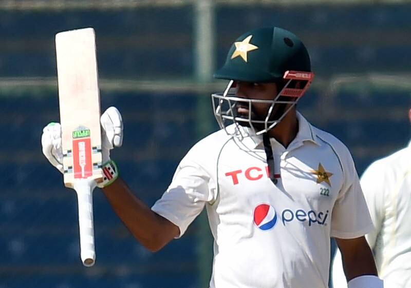 Pakistan's Babar Azam shows his bat after 50 runs during the fourth day of the second Cricket Test Match between Pakistan and Australia at the National Cricket Stadium in Karachi, Pakistan, 15 March 2022.   EPA / SHAHZAIB AKBER