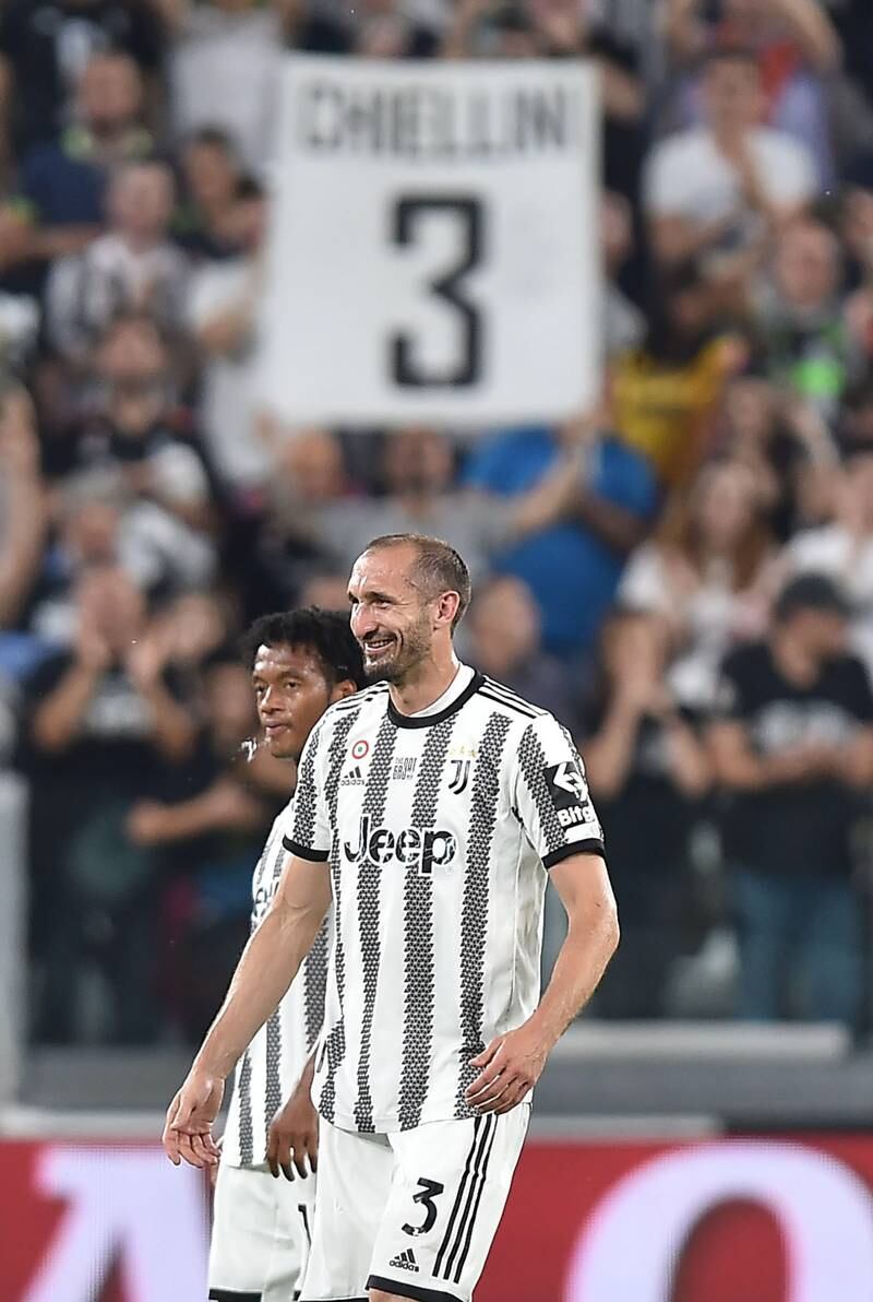 A Juventus supporter holds up a sign for Juve defender Giorgio Chiellini. EPA