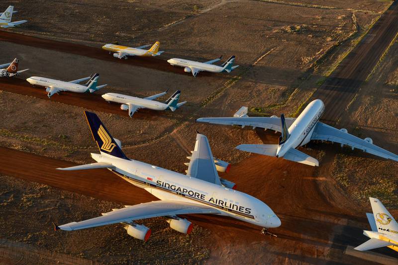 ALICE SPRINGS, AUSTRALIA - MAY 15: Grounded aeroplanes which include Airbus A380s, Boeing MAX 8s and other smaller aircrafts are seen at the Asia Pacific Aircraft Storage facility on May 15, 2020 in Alice Springs, Australia. The number of passenger planes housed at the Asia Pacific Aircraft Storage facility has increased due to the Coronavirus (COVID-19) pandemic with at least four Airbus A380 planes grounded there, the first time the aircraft has landed at Alice Springs. (Photo by Steve Strike/Getty Images)
