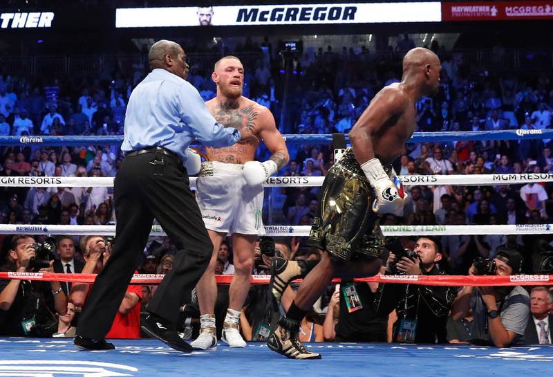 Floyd Mayweather celebrates after winning the fight after referee Robert Byrd stops Conor McGregor. Reuters