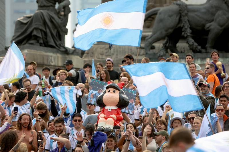 Fans celebrate Argentina's triumph over France in the World Cup final at the Angel of Independence monument in Mexico City, Mexico. Reuters