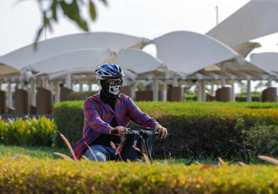 Abu Dhabi, United Arab Emirates, August 14, 2020.  People using bicycles as mode of transportation is now more evident at the Corniche, Abu Dhabi on an early Friday evening due to the Covid-19 pandemic.Victor Besa /The NationalSection:  NAFor:  Standalone/Stock Images