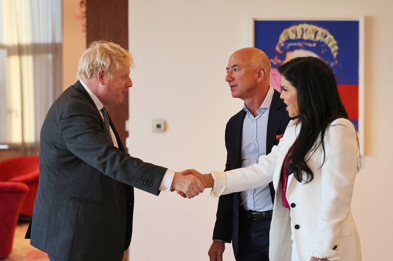 UK Prime Minister Boris Johnson greets Amazon founder Jeff Bezos and his girlfriend, Lauren Sanchez. AP