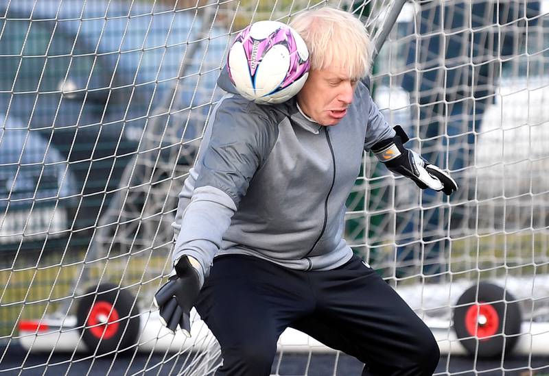 Mr Johnson takes a turn in goal during the warm up before a girls' football match between Hazel Grove United JFC and Poynton Juniors in December 2019. Getty Images
