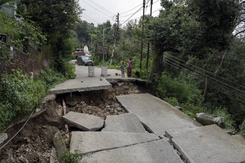 Severe damage to a road in Dharmsala, Himachal Pradesh state. AP Photo