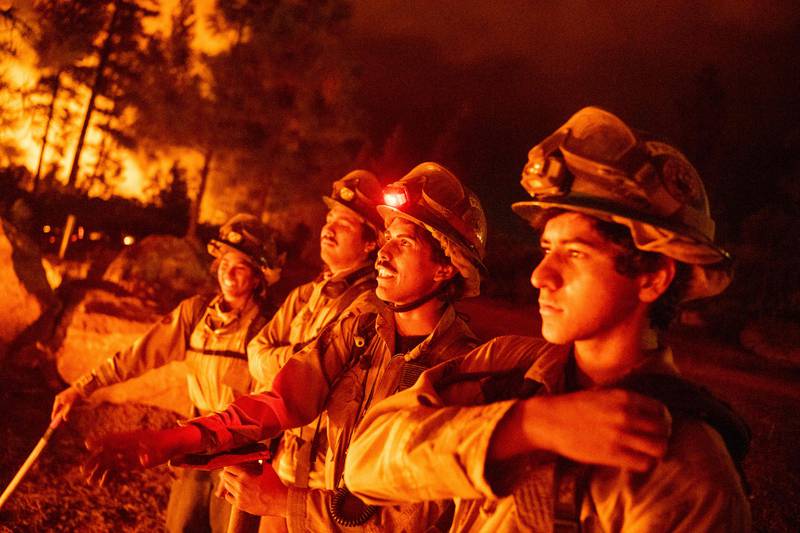 Firefighters monitor a blaze during the Mosquito Fire in California on September 13.  AFP