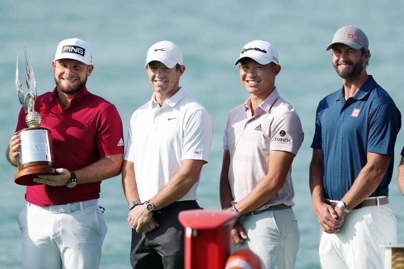 Tyrrell Hatton of England, Rory McIlroy of Northern Ireland, Collin Morikawa of the USA and Adam Scott of Australia pose for a photo prior to the Abu Dhabi HSBC Championship at Yas Links Golf Course on January 18, 2022 in Abu Dhabi. Getty Images
