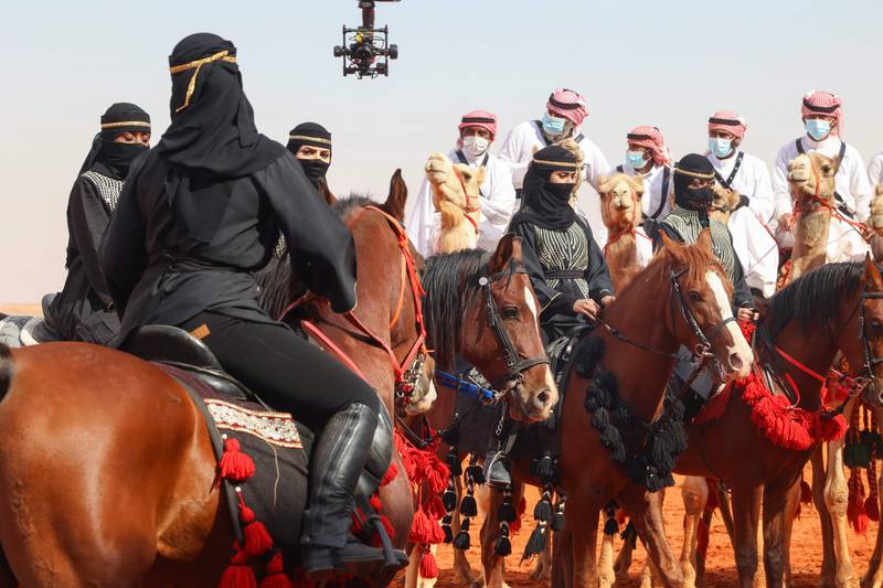 Saudi horsewomen take part in a parade during the sixth King Abdulaziz Camel Festival in Rumah, 160 kilometres east of Riyadh.  AFP