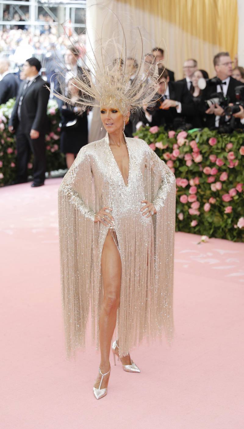 epa07552206 Celine Dion arrives on the red carpet for the 2019 Met Gala, the annual benefit for the Metropolitan Museum of Art's Costume Institute, in New York, New York, USA, 06 May 2019. Gold fringe dress by Oscar de la Renta, shoes by Chloe Gosselin, headpiece by Noel Stewart. The event coincides with the Met Costume Institute's new spring 2019 exhibition, 'Camp: Notes on Fashion', which runs from 09 May until 08 September 2019.  EPA-EFE/JUSTIN LANE