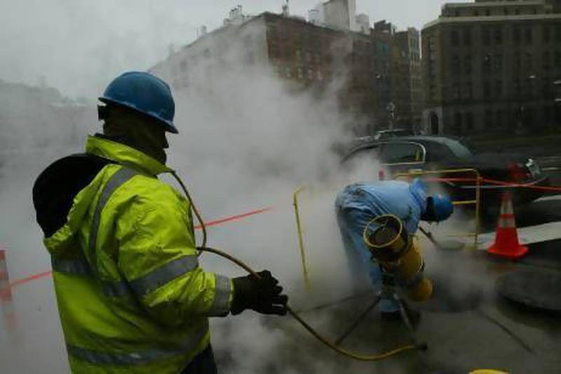 Workers with the Con Edison utility company open a manhole to the underground steam tunnels under the streets of New York. Data analysis helped Con Edison discover why manhole covers were exploding.
Chris Hondros/Getty Images)