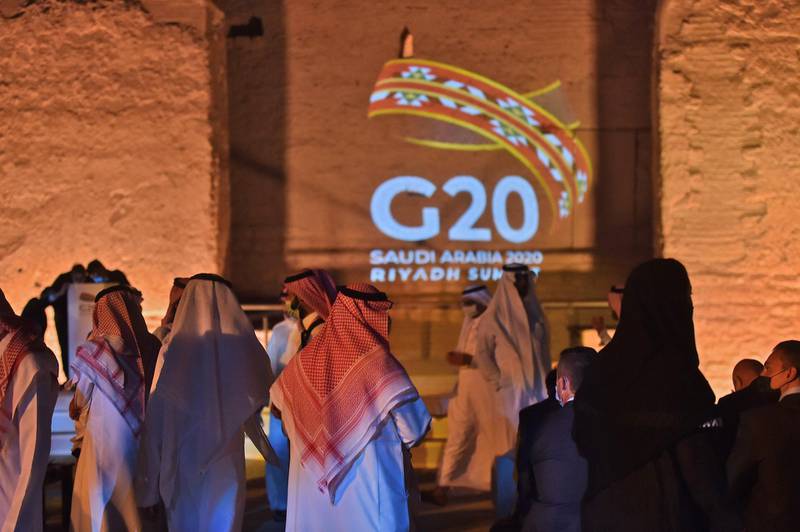 The G20 logo is projected at the historic site of al-Tarif in Diriyah district, on the outskirts of Saudi capital Riyadh. Saudi Arabia hosts the G20 summit on November 21 in a first for an Arab nation, with the downsized virtual forum dominated by efforts to tackle a resurgent coronavirus pandemic and crippling economic crisis. AFP