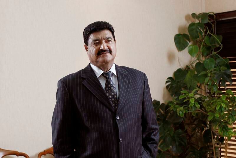 ABU DHABI, UNITED ARAB EMIRATES - December 31, 2009: Dr B. R. Shetty, Managing Director and CEO of NMC Group (NMC Specialty Hospital, UAE Exchange, Neopharma) stands for a portrait in his office. ( Ryan Carter / The National ) *** Local Caption ***  RC001-DrShetty20091231.jpg