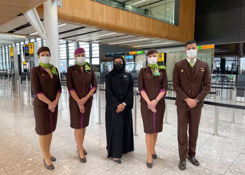 Etihad cabin crew with Mariam Al Qubaisi, centre, Etihad's head of sustainability, at London Heathrow