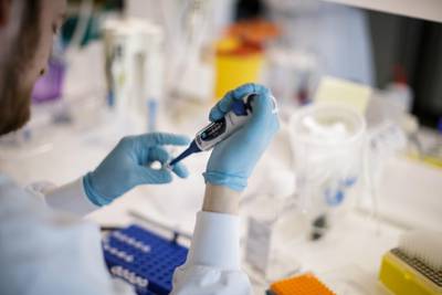 A researcher works on a vaccine against the new coronavirus at the Copenhagen University research lab. AFP