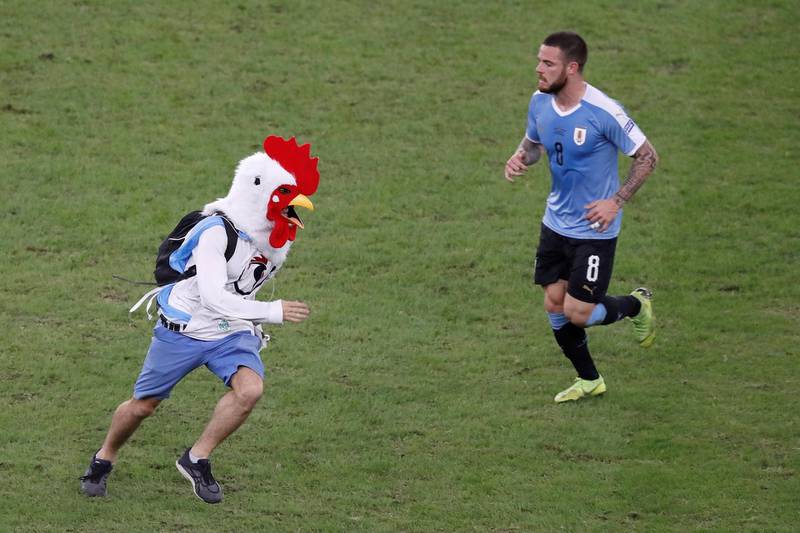 A pitch invader runs on the field during the Copa America 2019 Group Cmatch between Chile and Uruguay, at the Maracana Stadium in Rio de Janeiro. EPA