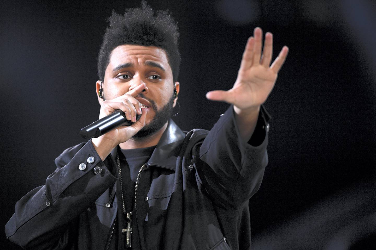 Canadian singer/songwriter The Abel Tesfaye a.k.a The Weeknd performs during the 2016 Victoria's Secret Fashion Show at the Grand Palais in Paris on November 30, 2016.  / AFP PHOTO / Martin BUREAU / RESTRICTED TO EDITORIAL USE