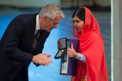 OSLO, NORWAY - DECEMBER 10:  Thorbjorn Jagland of Norway and Malala Yousafzai accepts the Nobel Peace Prize Award during the Nobel Peace Prize ceremony at Oslo City Town Hall on December 10, 2014 in Oslo, Norway. (Photo by Nigel Waldron/Getty Images)