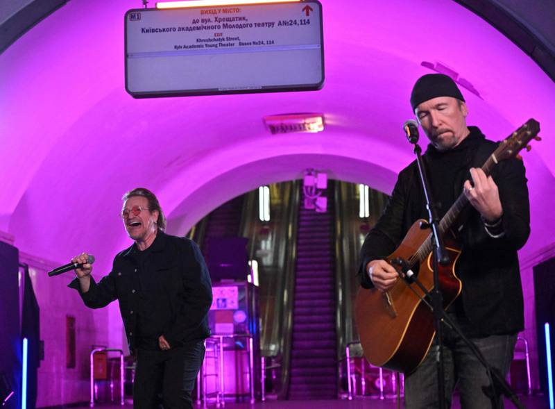 Bono and the Edge perform in the subway station which is also used as a bomb shelter. AFP