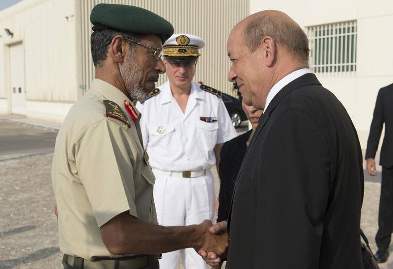 The French defence minister Jean-Yves Le Drian, right, with the Chief of Staff of the UAE Armed Forces, Lt Gen Hamad Mohammed Thani Al Rumaithi, in Abu Dhabi. French planes carried out their first reconnaissance flights over Iraq in support of the US-led campaign against ISIL. AFP