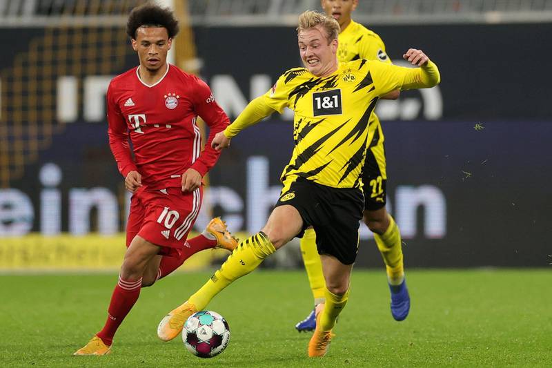 Dortmund's Julian Brandt under pressure from Leroy Sane of Bayern. EPA