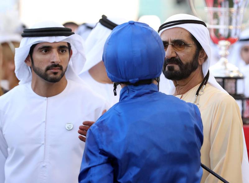 Dubai, United Arab Emirates - March 30, 2019: William Buick speaks with Sheikh Mohammed bin Rashid Al Maktoum and Sheikh Hamdan bin Mohammed Al Maktoum (L) after Blue Point ridden by William Buick wins the Al Quoz Sprint during the Dubai World Cup. Saturday the 30th of March 2019 at Meydan Racecourse, Dubai. Chris Whiteoak / The National