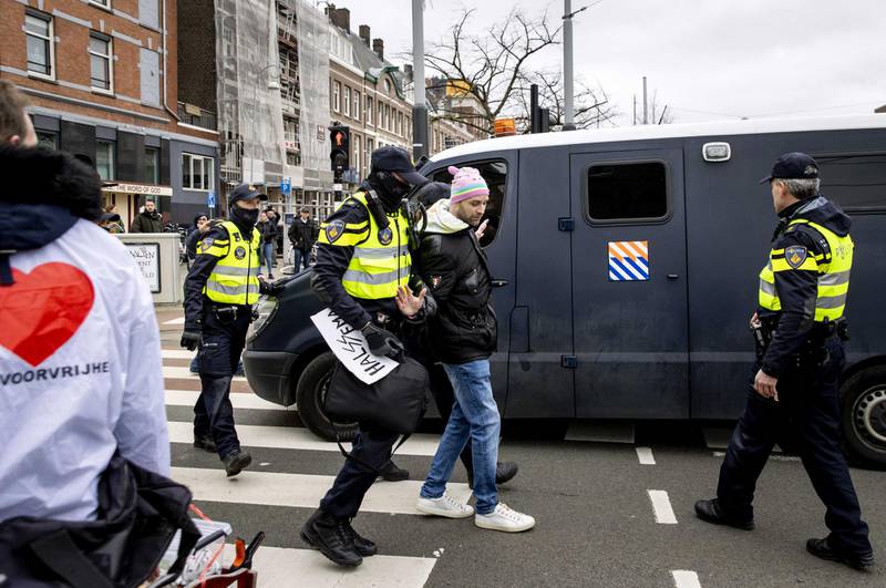 Police start clearing the area of protesters during an anti-lockdown demonstration in Amsterdam, the Netherlands. EPA