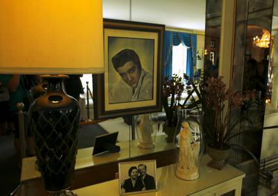 Pictures of Elvis Presley and his parents on display at Graceland. Reuters