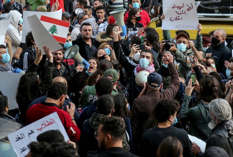 Students from different universities carry placards, wave Lebanese flags during a demonstration under the slogan of 'A Day of Student Rage' in Al-Hamra, Beirut. EPA