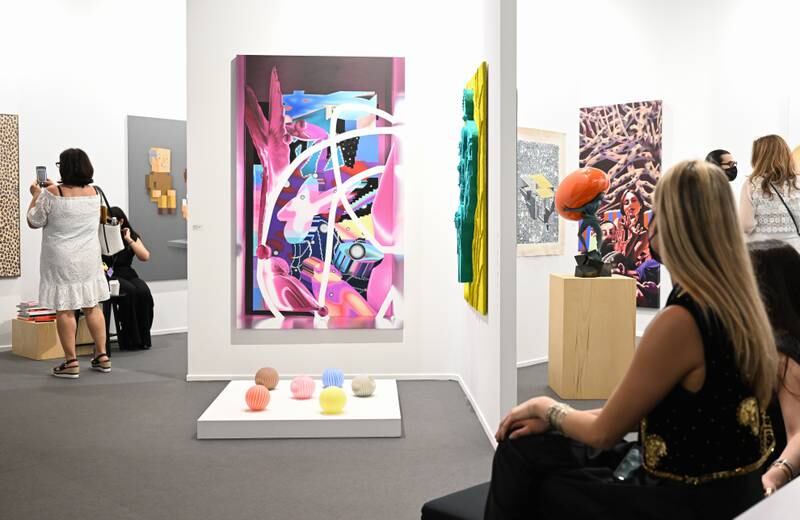 Visitors observe artistic installations during the preview of Art Dubai 2022. Getty Images