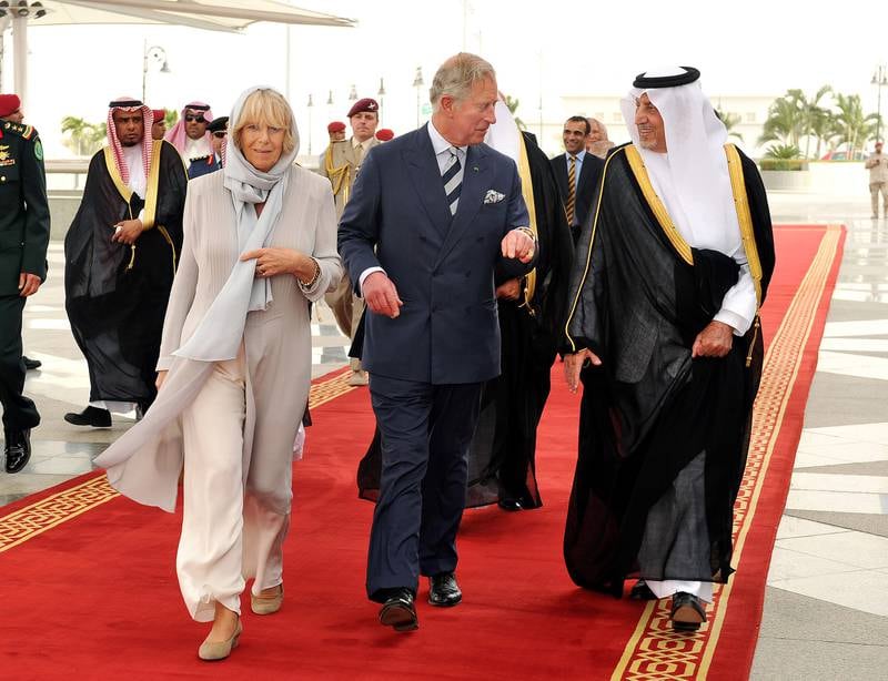 Camilla and Prince Charles are met at Jeddah Airport by the Governor of Makkah Prince Khalid al Faisal on March 16, 2013. Getty Images
