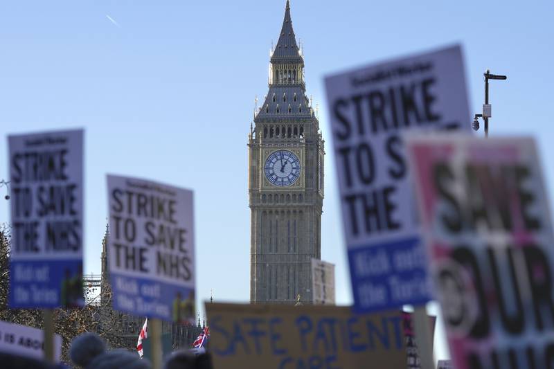 Nurses participate in a protest outside the St Thomas' Hospital in London in December. AP Photo
