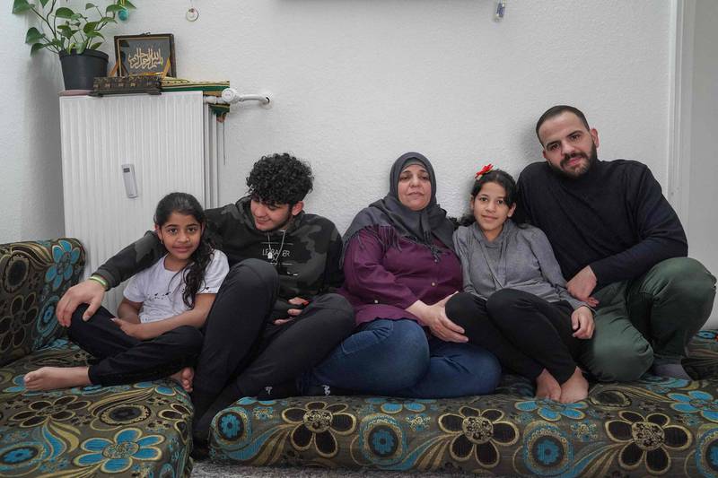 Sabrina al-Fayyad, (C) and her children Shahed (L-R), Mohamed, Tasnim and Abdo sit in their living room in their home in Vejle, Denmark during an interview with AFP on May 5, 2021.  Sabriya al-Fayyad fled her home in Deraya with her family because of the conflict in Syria and settled in Denmark but in late March her residency papers and those of her two young daughters were revoked. From mid-2020, Copenhagen decided to re-examine the cases of about 500 Syrians from Damascus, which is under the control of Bashar al-Assad's regime and ruled “the current situation in Damascus is no longer such as to justify a residence permit or the extension of a residence permit".                                / AFP / Tom LITTLE / TO GO WITH AFP STORY by

