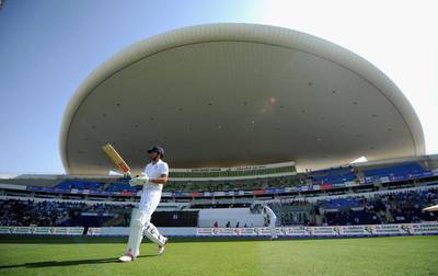 England captain Alastair Cook walks out to bat for the second session. Gareth Copley / Getty Images