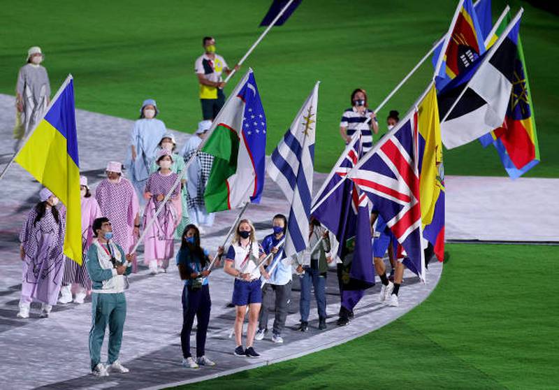 Flag bearers of the competing nations enter the stadium during the closing ceremony in Tokyo.