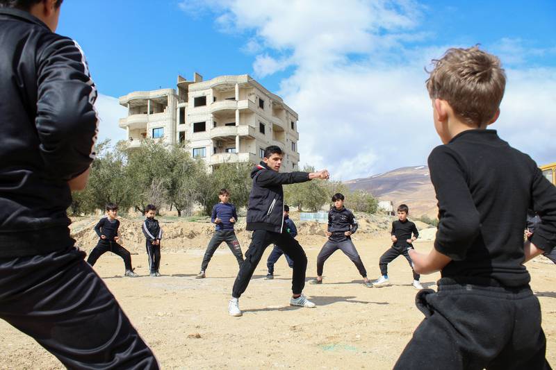 Boys take part in martial arts training in Syria.