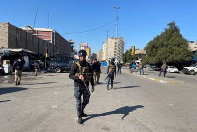 Iraqi security forces keep guard at the site of a suicide attack in Baghdad. Reuters