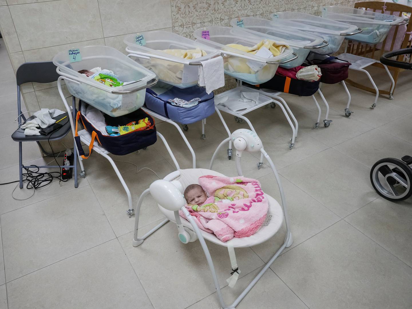 Surrogate-born babies are seen inside a special shelter owned by BioTexCom clinic in a residential basement on the outskirts of Kyiv. Reuters